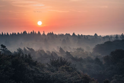 Panoramic view of landscape against sky during sunset