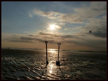 Scenic view of sea at sunset