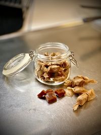 High angle view of candy in glass jar on table