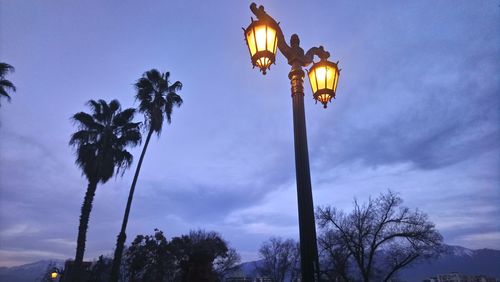 Low angle view of street light against sky