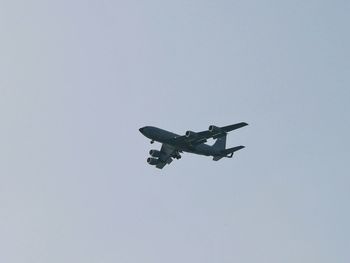 Low angle view of airplane against clear sky