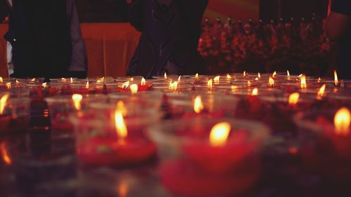 Illuminated candles in temple