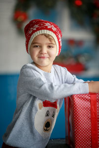 Portrait of cute girl wearing santa hat