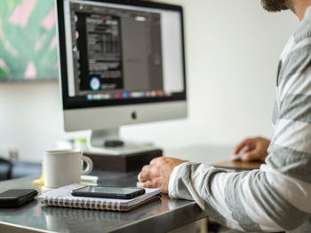 Man working on the computer desktop at home