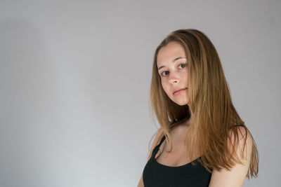 Portrait of a beautiful young woman over white background