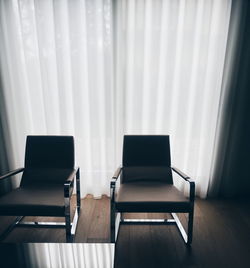 High angle view of empty chairs on floor against curtains