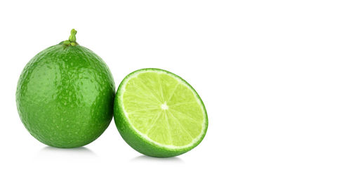 Close-up of fruits against white background