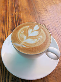 High angle view of cappuccino on table