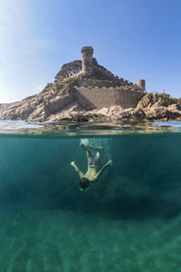 Full length of boy diving in sea