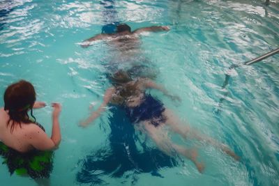 High angle view of woman swimming in pool