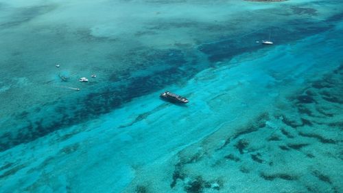 Aerial view of boats in blue sea