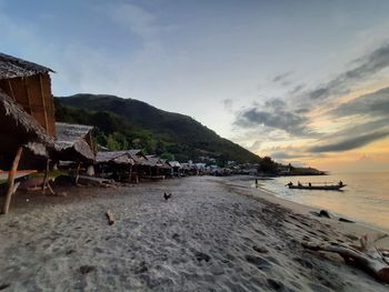 Scenic view of beach against sky during sunset