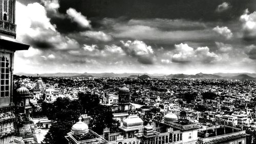 High angle view of city against cloudy sky