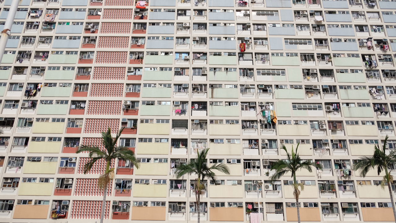 building exterior, architecture, built structure, apartment, residential district, city, window, building, full frame, day, plant, balcony, no people, tree, outdoors, nature, low angle view, in a row, pattern, repetition