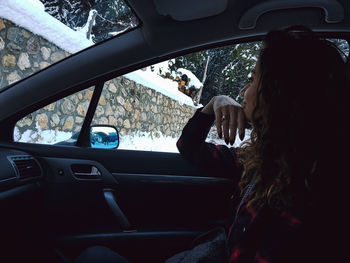 Woman sitting in car