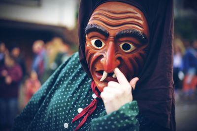 Close-up of person wearing mask at carnival