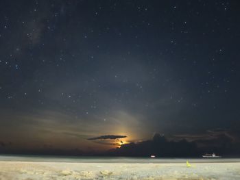 Scenic view of sea against sky at night