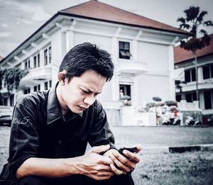 Young man using mobile phone