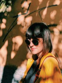 Portrait of a young woman wearing sunglasses