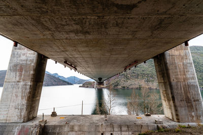 Modern suspension bridge across reservoir los barrios de luna in castile and leon, spain.