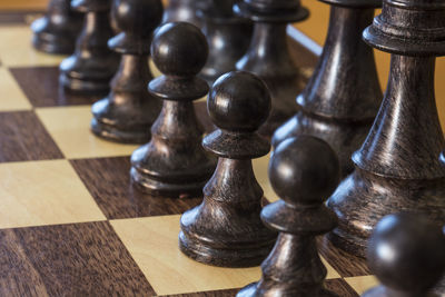 Close-up of chess pieces on board