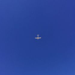 Low angle view of vapor trails in sky