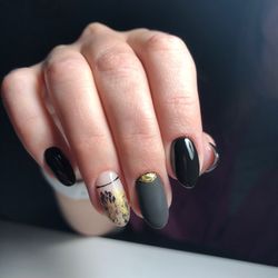 Close-up of woman hand over black background