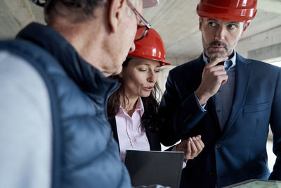 Engineers brainstorming at construction site