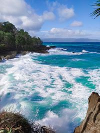 Enjoying the waves from the top of the cliff in nirun beach, kei islands, moluccas, indonesia.