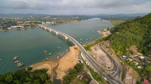 High angle view of river by town against sky