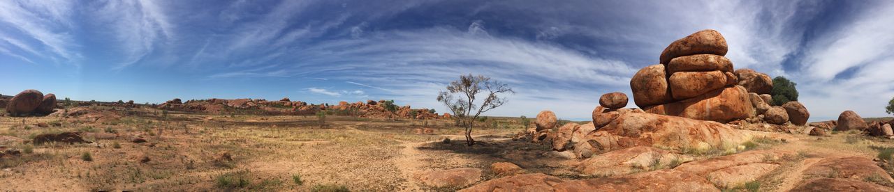 tranquility, tranquil scene, rock formation, sky, scenics, landscape, rock - object, nature, beauty in nature, geology, cloud - sky, physical geography, non-urban scene, cloud, rock, blue, mountain, eroded, remote, idyllic