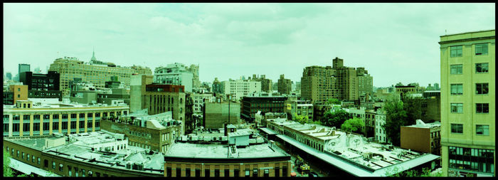 High angle view of buildings in city against sky