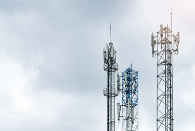 Telecommunication tower with gray sky. antenna. radio and satellite pole. communication technology. 