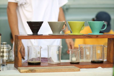 Close-up of wine glasses on table