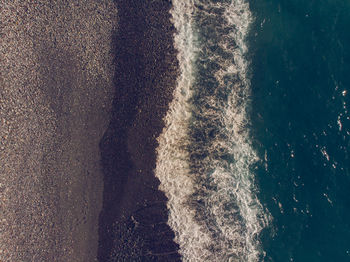 High angle view of waves on beach