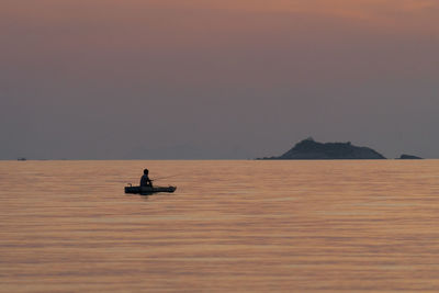 Scenic view of sea at sunset