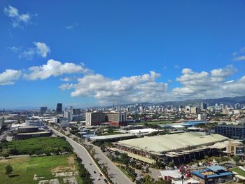 High angle view of buildings in city against sky
