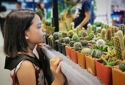 Young woman looking at market stall