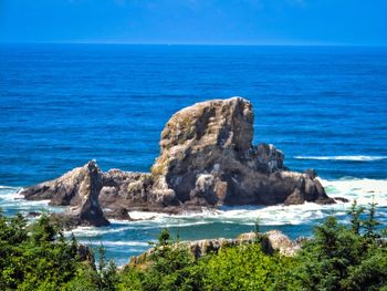 Scenic view of sea against blue sky