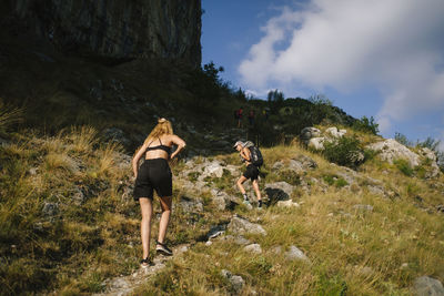 Full length of woman standing on rock