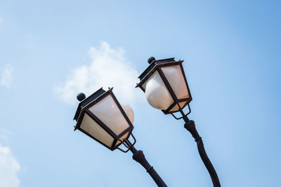 Low angle view of street light against sky