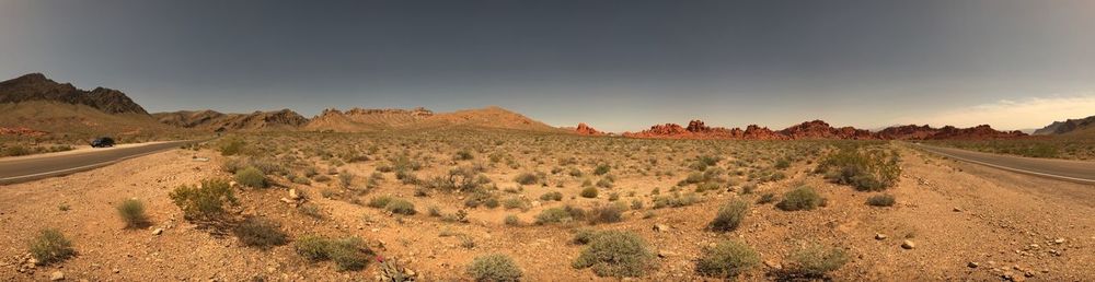Panoramic view of road amidst desert against sky