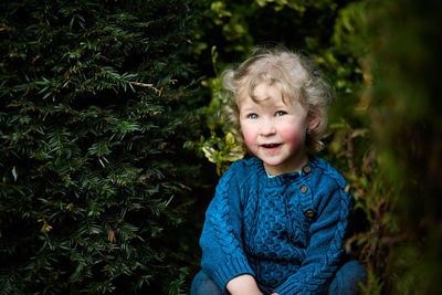 Portrait of cute girl with plants