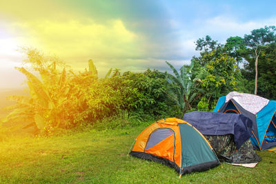 Tent in field against sky