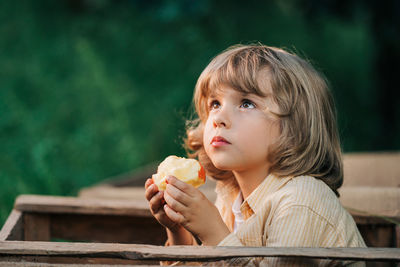 Portrait of young woman eating food