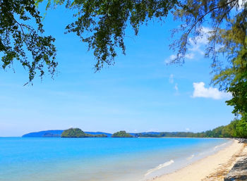 Scenic view of sea against blue sky