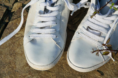 High angle view of shoes on beach