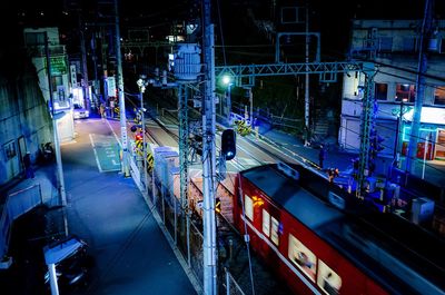 High angle view of cars on road in city at night