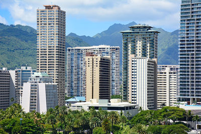 Buildings in city against sky