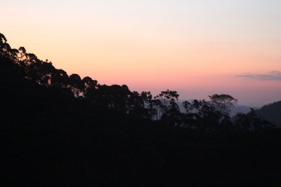 Silhouette landscape against sky during sunset